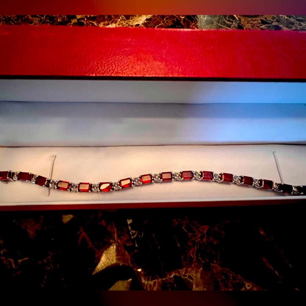 Garnet and white gold tennis bracelet